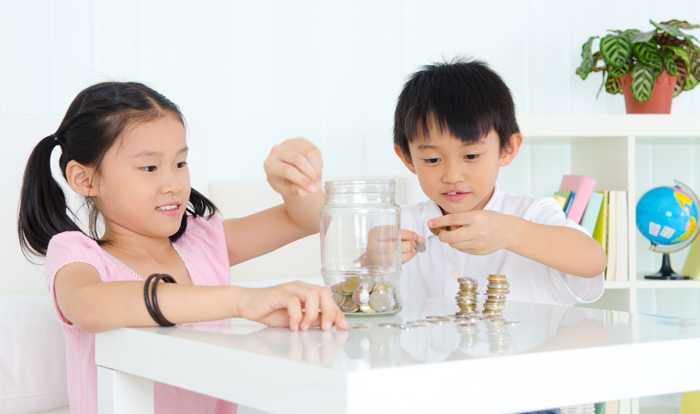two kids playing with coins