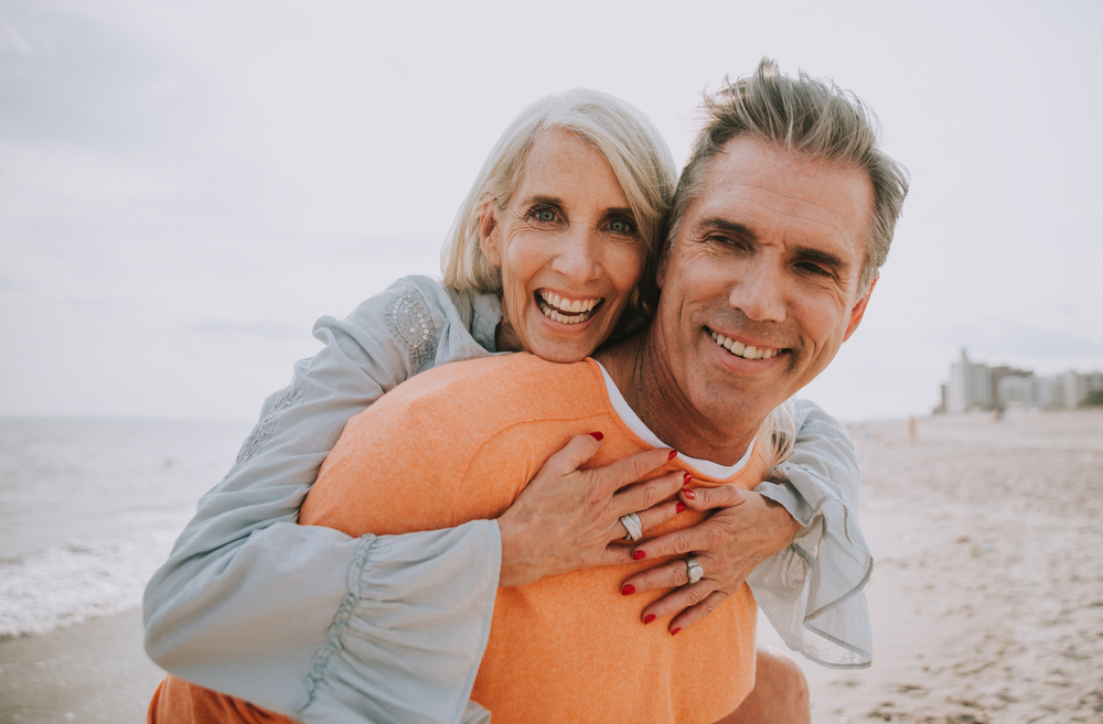 Happy senior couple on beach