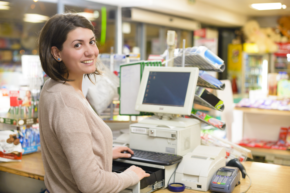 Woman at point of sale terminal.