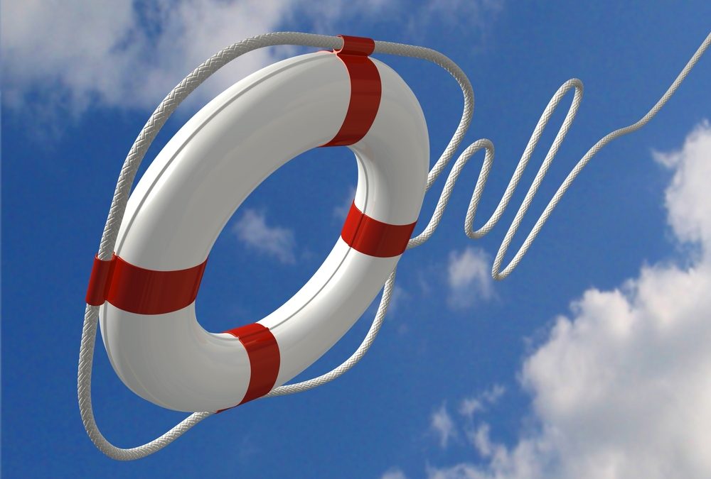 Life buoy being thrown against blue sky