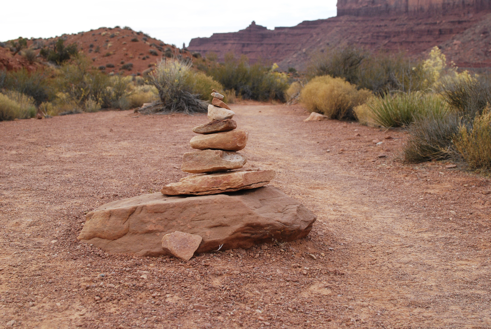 A cairn, or pile of stones, in red desert landscape, Utah, USA