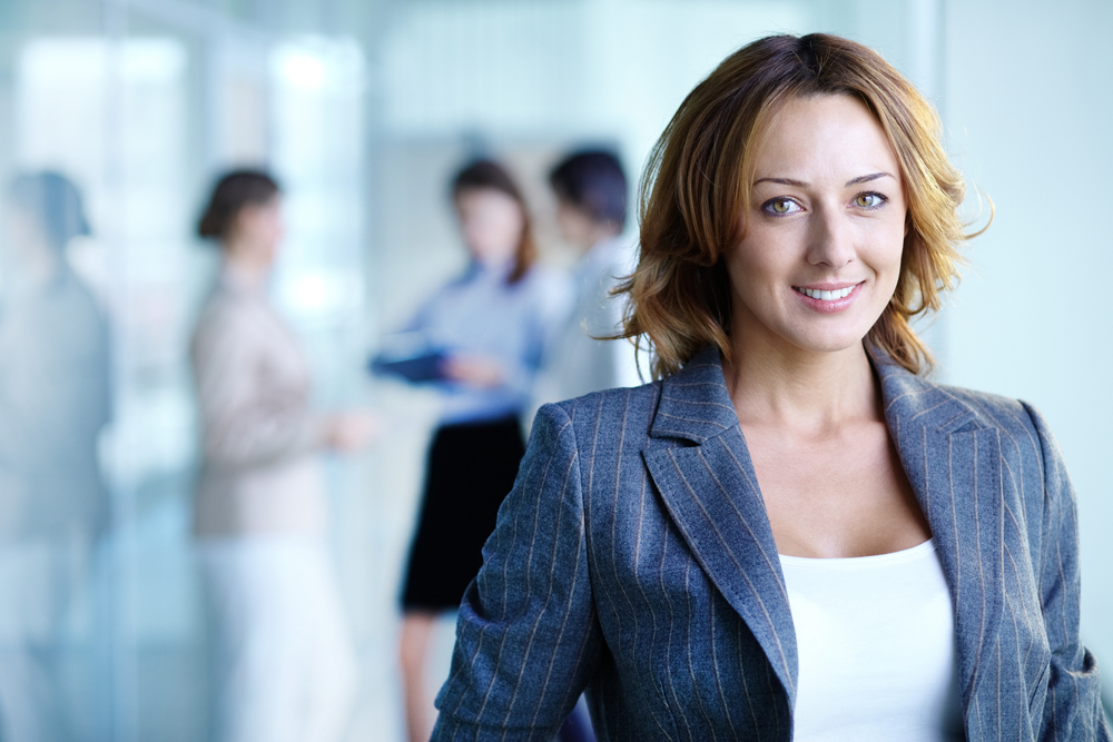 Image of businesswoman looking at camera
